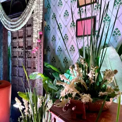 Detail shot of a corner table, featuring floral arrangements and decor pieces that complement the overall Southern Grace theme.
