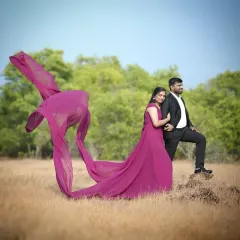 This magenta flying dress is designed for drama. The lightweight trail catches the wind beautifully, creating a dynamic and powerful image for this couple's outdoor shoot.