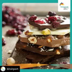 A close-up of our stacked artisanal chocolate bars, available at our Kempegowda International Airport location. A perfect, premium souvenir from Bangalore.