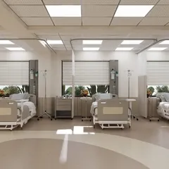 Patient bays are designed for both care and comfort. Each bed has access to natural light through large windows with adjustable blinds, allowing patients to connect with the time of day, which is crucial for recovery. The layout provides ample space for medical equipment and family members.