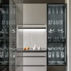 The Ahmedabad showroom, designed by Anarr Gunjaria, features this elegant display with illuminated glass cabinets, creating an environment that feels both elevated and approachable.
