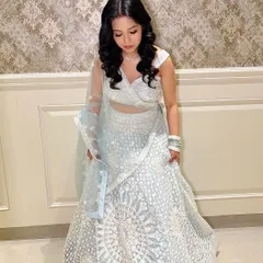 A candid moment, showing the flow of her outfit.