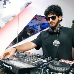 A cool, stylish shot of me at the Pioneer DJ decks. I believe a DJ's presence and style are part of the overall performance.