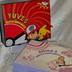 Two different themes for two different personalities. On the left, a popstar-themed 'Box of Happiness' for Amira, and on the right, the Pokémon-themed box for Yuvi.