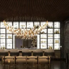 A dynamic and luxurious bar I crafted for a project at DLF Camellias. The backlit shelving, statement chandelier, and dark marble create a sophisticated atmosphere perfect for entertaining.