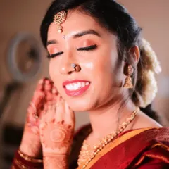 A beautiful, happy close-up of Lavanya. Her skin is glowing, and the natural-toned makeup enhances her features beautifully.