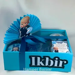A complete look at the personalized Boss Baby hamper for Ikbir, featuring a custom name, themed topper, and goodies inside.