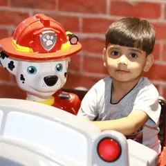 All paws on deck! A young adventurer gets ready to save the day on our popular Paw Patrol fire truck ride. Our kiddie rides and arcade section offer a different kind of excitement for when it's time for a break from climbing and sliding.