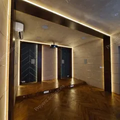 Here, linear LED lighting is integrated directly into the room's architecture, tracing the ceiling and doorways. This technique defines the space and guides the eye, creating a polished and cohesive design.