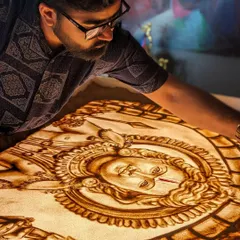 A closer look at the intricate work that goes into my sand art. Here, I'm defining the features of Lord Ram's face.