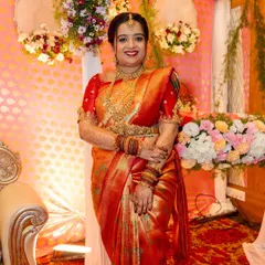 Priya looking radiant at her daughter's naming ceremony. I created a timeless look to match her beautiful red and gold silk saree.