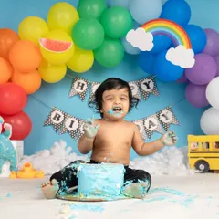 A first birthday is all about joy, and what's more joyful than a cake smash? This little one had the best time making a mess, and his happy, frosting-covered face says it all.
