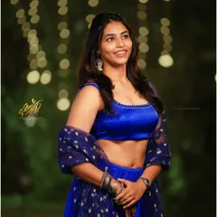 Capturing the natural smile and energy of actress Sapthami Gowda at an awards event. The soft, ambient lighting with a beautiful bokeh background makes this candid portrait feel both glamorous and genuine.