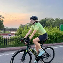 Riding into the sunset on a Scott road bike. This shot captures the beauty of evening rides and the dedication of our cyclists who train at all hours.