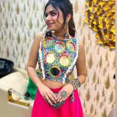 My vision for modern festive wear comes alive in this mirror-work crop top. It’s vibrant, playful, and perfect for a Navratri or sangeet night. I love designing pieces that are rooted in tradition but have a contemporary, fun twist.