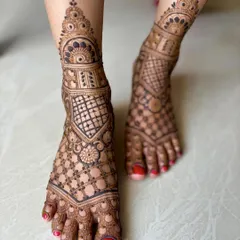 A full-coverage feet design with dense geometric and floral patterns, perfect for a bride.