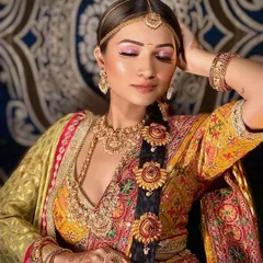 A close-up on the details of this South Indian look. The pink-toned eyeshadow and intricate hair accessories are key elements that I focus on to create an authentic style.