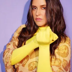 This powerful pose captures the confidence and attitude of the look. My job is to help you embody the character you want to portray through your style.