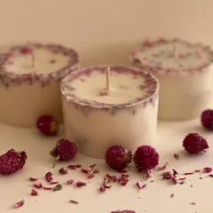 I love incorporating natural elements into my work. These are my artisanal votive candles, made with soy wax and infused with real dried rose petals. They not only smell wonderful but also add a touch of botanical beauty to your space.
