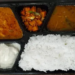 A simple and wholesome vegetarian meal box. This one features a Gobi Masala curry, a potato fry, sambar, rice, and fresh homemade curd.