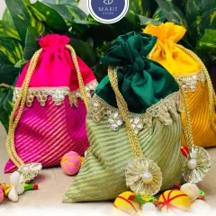 A touch of royalty in every 'potli'. These vibrant bags are filled with premium quality dry fruits, making them a perfect, healthy, and elegant gift for any occasion.