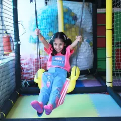 Pure joy on the swing set. I aim to capture these action shots that show the fun-filled activities at a children's party.