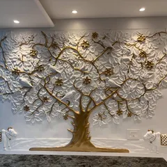 I designed this Kalpavriksha tree as a symbol of prosperity and creativity for a main office room. It's a custom 3D fibre mural with gold and white detailing, creating an incredible backdrop for the company's leader.
