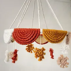 A beautiful and gentle crib mobile to soothe a baby to sleep. I used warm, earthy tones like rust, mustard, and beige to create the hanging elements, making it a stylish addition to any nursery.