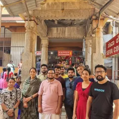 Our group at a temple during our Udupi Kambala experiential trip. We combine cultural events with visits to local spiritual sites.