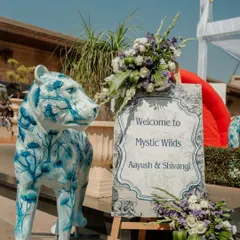 Welcome to the Mystic Wilds. For this carnival, we created an aesthetic dream in blue and white, with custom-painted animal statues and signage that set a unique and artistic tone for the event.