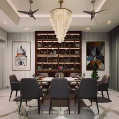 This formal dining lounge is crafted for elegant entertaining. The room is centered around a magnificent tiered crystal chandelier, with a custom-built, backlit shelving unit for wine and display. The combination of marble flooring and plush seating creates a sophisticated yet inviting space for hosting.