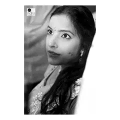 A candid, emotional moment captured at a baby shower. This black and white close-up focuses on the mother-to-be's expressive eyes, filled with love and anticipation. These unposed shots are often the most powerful.