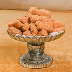 These are my handcrafted gur pare, a traditional sweet and crunchy snack. Each piece is made with care to bring back the authentic flavors and charm of timeless wedding celebrations.