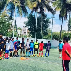 This is a trials day at my academy. I am addressing a group of aspiring players, looking for individuals with skill, attitude, and a willingness to work hard. This is the first step to joining my competitive youth teams.