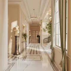 I use light and architecture to create rhythm in long spaces. This corridor features a striking checkerboard marble runner, classical busts on pedestals, and elegant wall sconces that guide the eye and create a sense of procession and grandeur.