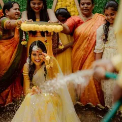 The fun continues at the Haldi function. The bride's smile shows how much fun these ceremonies are, and our decor provides the perfect festive background.