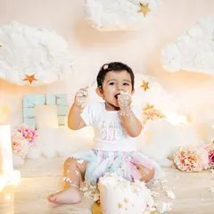 This little one is proud to be one and isn't afraid to get messy. The "I am ONE" shirt and a face full of frosting make for the perfect cake smash photo.