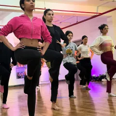 Students practicing a balancing exercise during our warm-up. Building a strong foundation with proper technique is an important part of every class.