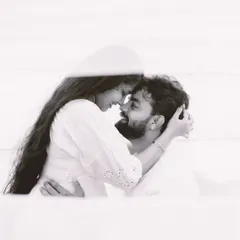A tender, artistic black and white close-up that focuses purely on the couple's connection. This style of photography is perfect for capturing the deep, unspoken bond between two people.