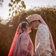 Bathed in the soft, golden hour light, this couple shares a sweet, candid moment. My goal is to capture the genuine smiles and affection that you share.