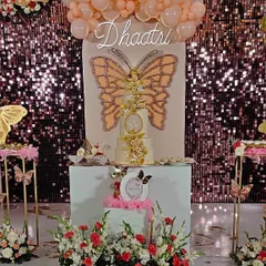 It was a privilege to design this butterfly-themed 3rd birthday for the great-granddaughter of our honorable Ex-Prime Minister, Shri H.D. Devegowda. The setup features a sequin backdrop and a stunning butterfly centerpiece.