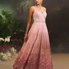 The Celine Gown showcases a beautiful transition of color. I designed this piece with a delicate pink ombre effect, fully embellished with sequins and beads in a chevron pattern for a shimmering, ethereal look.