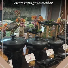 Every detail is delicious, and every setting is spectacular. This setup features our stylish black serving dishes and unique decorative elements like golden flamingo statues, adding a touch of sophistication.