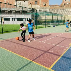 One-on-one dribbling practice with our younger players, making learning fun and interactive.