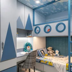For this child's room, we built a custom bunk bed that combines playfulness with practicality. The design includes a cozy lower bunk, an upper play area with porthole windows, and an integrated study nook with its own lighting, ensuring the space can grow with the child from playtime to homework.