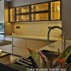 Take a peek inside one of our favorite kitchen projects. The warm, under-cabinet lighting highlights the beautiful glassware, while the sleek, modern faucet and minimalist cabinetry create a space that is both inviting and impeccably stylish.