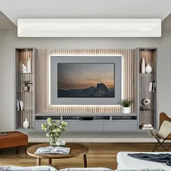 This floating media unit is a great example of minimalist design. We used a light grey finish with a fluted wood panel backdrop and integrated backlighting around the TV to create a soft, ambient glow, flanked by vertical display shelves.