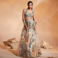 The Ivy Lehenga Set, designed for shimmery nights and glamorous days. This full look shows the organza layered lehenga with its embroidered motif and hand-embellished blouse.