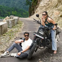 A relaxed and cool shot of the couple taking a break on their mountain road trip. It feels natural and captures their personalities perfectly.