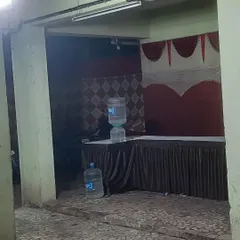 Even in compact spaces like a building's parking area, we can set up a functional service station. Here, we arranged a table for food and a water dispenser for guest convenience.